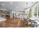 Bright kitchen with white cabinets, hardwood floors, an island, and stainless steel appliances at 1108 Longwood Ct, Matthews, NC 28104