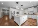 Modern kitchen featuring white cabinets, a granite island, stainless steel appliances, and hardwood floors at 1108 Longwood Ct, Matthews, NC 28104