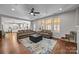 Open living room with hardwood floors, neutral furniture, and lots of natural light at 1108 Longwood Ct, Matthews, NC 28104