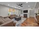 Cozy living room featuring a fireplace, built-in shelves, and comfortable seating at 1108 Longwood Ct, Matthews, NC 28104