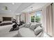 Well-lit main bedroom featuring a ceiling fan, a seating area, and exercise equipment at 1108 Longwood Ct, Matthews, NC 28104
