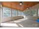 Sunroom with multiple windows, ceiling fans, natural lighting and carpet at 1108 Longwood Ct, Matthews, NC 28104