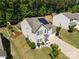 Aerial view of the front of the home and yard, with well-maintained landscaping and solar panels at 1125 Jasmine Dr, Fort Mill, SC 29707