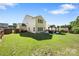 Large backyard with a well-maintained lawn, patio, gazebo, and privacy fence, perfect for outdoor gatherings at 1125 Jasmine Dr, Fort Mill, SC 29707