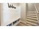Foyer with storage bench, coat hooks, stairs, and light wood-style flooring at 1125 Jasmine Dr, Fort Mill, SC 29707