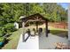Backyard patio view of the gazebo with table, chairs, and grill, ready for outdoor entertaining at 1125 Jasmine Dr, Fort Mill, SC 29707