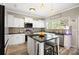 Well-lit kitchen with a central island, granite countertops, and modern appliances at 1125 Jasmine Dr, Fort Mill, SC 29707