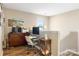 Bright office space features a desk, computer and a large window offering plenty of natural light at 1125 Jasmine Dr, Fort Mill, SC 29707