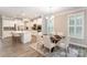 This dining area is conveniently located near the kitchen and features modern furnishings and decor at 113 Callandor Ct, Troutman, NC 28166