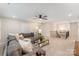 Spacious upstairs living room with carpeted floor, a comfy sofa, and stairs to the floor below at 113 Callandor Ct, Troutman, NC 28166