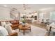 A spacious living space seamlessly connects the Gathering room, kitchen, and dining room at 113 Callandor Ct, Troutman, NC 28166