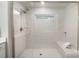 Elegant walk-in shower featuring a glass enclosure, neutral tile, and a built-in bench at 113 Callandor Ct, Troutman, NC 28166