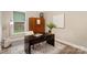 The home office features a neutral color palette and natural lighting at 113 Callandor Ct, Troutman, NC 28166