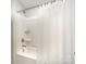 Clean shower and tub combo with white surround and a shower curtain, providing a refreshing space at 113 Callandor Ct, Troutman, NC 28166