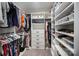 Spacious walk-in closet with custom shelving, hanging rods, and ample storage options at 113 Callandor Ct, Troutman, NC 28166