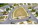 An aerial view of the community with sidewalks and a center green space lined with trees at 1313 Forkhorn Dr, Monroe, NC 28110