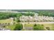 Aerial view of community with green spaces, showcasing a blend of residential homes and natural beauty at 1313 Forkhorn Dr, Monroe, NC 28110