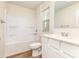Bright bathroom with a bathtub and shower combination, modern sink, vanity, and fixtures at 1313 Forkhorn Dr, Monroe, NC 28110