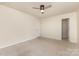 Spacious bedroom featuring neutral carpeting, ceiling fan, and an ample closet space at 1313 Forkhorn Dr, Monroe, NC 28110