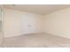 Neutral-colored bedroom with carpeting, window, and double door closet at 1313 Forkhorn Dr, Monroe, NC 28110