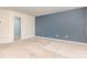A comfortable bedroom features a stylish accent wall and cozy carpet, ready for your personal touch at 1313 Forkhorn Dr, Monroe, NC 28110