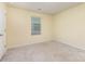 Carpeted bedroom with a window that provides ample natural light at 1313 Forkhorn Dr, Monroe, NC 28110