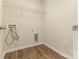 Walk-in closet featuring laminate wood flooring and a wire shelf, ideal for organized storage and easy access at 1313 Forkhorn Dr, Monroe, NC 28110