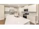 Modern kitchen featuring sleek white cabinets, stainless steel appliances, and subway tile backsplash at 1313 Forkhorn Dr, Monroe, NC 28110