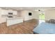 Spacious open-concept living room with a modern kitchen and hardwood floors for today's living at 1313 Forkhorn Dr, Monroe, NC 28110