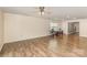 A spacious living area with beautiful wood floors, a ceiling fan, and lots of natural light at 1313 Forkhorn Dr, Monroe, NC 28110