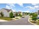 Street view showing well-maintained homes with manicured lawns enhancing curb appeal in a desirable neighborhood at 1313 Forkhorn Dr, Monroe, NC 28110