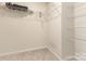 Organized walk-in closet equipped with multiple shelves for ample storage at 1313 Forkhorn Dr, Monroe, NC 28110