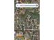 Aerial view of a neighborhood with tree-lined streets and homes near a lake, as seen from above at 1921 Notchwood Ct, Clover, SC 29710
