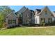 Beautiful two-story brick home featuring a well-manicured lawn and charming architectural details at 1921 Notchwood Ct, Clover, SC 29710