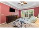 This bedroom has nice windows, tray ceiling, and a flatscreen television at 2035 Moultrie Ct, Fort Mill, SC 29707
