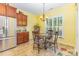 Charming breakfast nook with stainless steel refrigerator and a bright window at 2035 Moultrie Ct, Fort Mill, SC 29707
