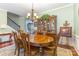 Elegant dining room with a hardwood floor, a large table, a hutch, and a chandelier at 2035 Moultrie Ct, Fort Mill, SC 29707