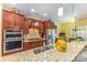 Open kitchen featuring granite countertops, stainless appliances, and ample cabinet space at 2035 Moultrie Ct, Fort Mill, SC 29707