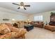 Inviting living room with neutral walls, ceiling fan and comfortable seating with natural light at 2035 Moultrie Ct, Fort Mill, SC 29707