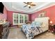 Serene primary bedroom with shuttered windows, soft colors, and carpeted flooring at 2035 Moultrie Ct, Fort Mill, SC 29707