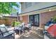 Outdoor entertaining with a view featuring brick accents, grill, and comfortable seating at 2124 Chambwood Dr, Charlotte, NC 28205