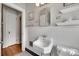 Charming bathroom featuring a vintage sink, tiled walls, and black and white tiled floor at 2124 Chambwood Dr, Charlotte, NC 28205
