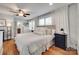 Bedroom with hardwood floors, ceiling fan, and lots of natural light at 2124 Chambwood Dr, Charlotte, NC 28205