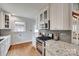 Modern kitchen featuring stainless steel appliances, granite countertops, and ample cabinet space at 2124 Chambwood Dr, Charlotte, NC 28205