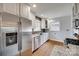 Bright kitchen featuring white cabinets, stainless steel appliances, and granite countertops at 2124 Chambwood Dr, Charlotte, NC 28205