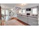 Spacious living room features hardwood floors, a staircase, and a fireplace creating a warm atmosphere at 2124 Chambwood Dr, Charlotte, NC 28205