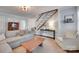 Cozy living room with hardwood floors, a fireplace, and an open staircase creating a comfortable space at 2124 Chambwood Dr, Charlotte, NC 28205