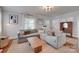 Comfortable living room showcasing a large sectional sofa, neutral tones, and stylish decor at 2124 Chambwood Dr, Charlotte, NC 28205