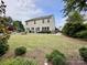 Large backyard with patio, fire pit, and ample space for outdoor enjoyment at 2330 Winthorp Ridge Rd, Charlotte, NC 28270