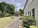 The backyard offers a relaxing patio area with a fire pit and mature landscaping at 2330 Winthorp Ridge Rd, Charlotte, NC 28270